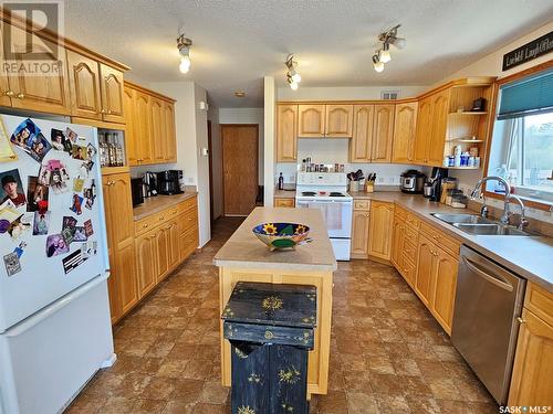 115 Carson Bay, Lampman, SK - Indoor Photo Showing Kitchen With Double Sink