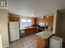 5324 51 Street, Fort Nelson, BC  - Indoor Photo Showing Kitchen With Double Sink 