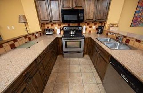 M2-A-1351 Gerry Sorensen Way, Kimberley, BC - Indoor Photo Showing Kitchen With Double Sink