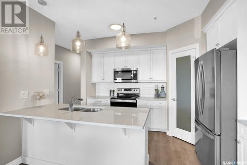 203 4594 Harbour Landing Drive, Regina, SK - Indoor Photo Showing Kitchen With Double Sink With Upgraded Kitchen