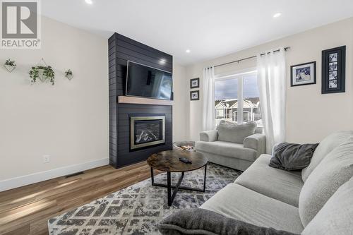 12 Ursula Crescent, St. Philips, NL - Indoor Photo Showing Living Room With Fireplace