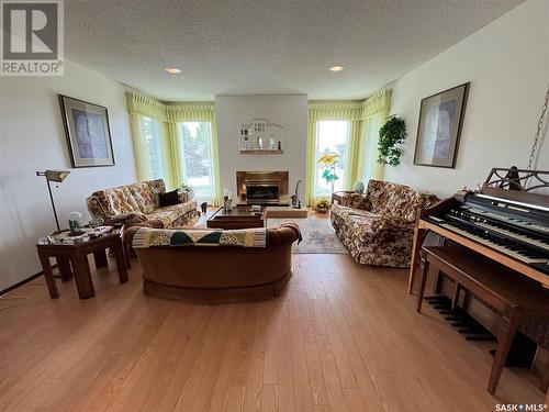 12 Chinook Place, Maple Creek, SK - Indoor Photo Showing Living Room With Fireplace