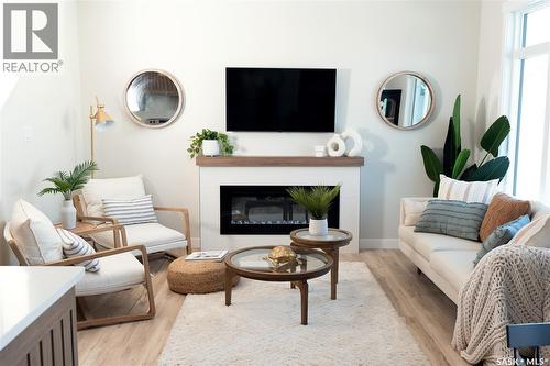 311 Veterans Drive, Warman, SK - Indoor Photo Showing Living Room With Fireplace