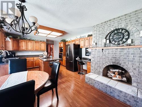9951 Belmont Road, Prince George, BC - Indoor Photo Showing Dining Room With Fireplace