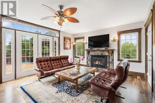 Living Room, doors to back deck - 39 Bonin Street, Champlain, ON - Indoor Photo Showing Living Room With Fireplace