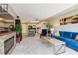 Living room with electric fireplace and newer carpet - 