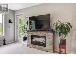 Electric fireplace in living room and access to covered deck - 
