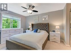 Primary bedroom with ceiling fan - 