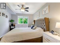 Primary bedroom with ceiling fan - 