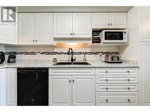 Kitchen with plenty of counter and cabinet space - 265 Froelich Road Unit# 204, Kelowna, BC - Indoor Photo Showing Kitchen With Double Sink