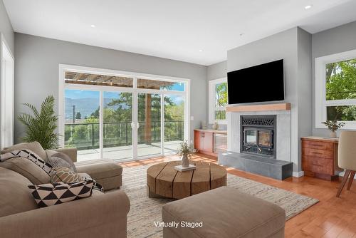 220 West Bench Drive, Penticton, BC - Indoor Photo Showing Living Room With Fireplace