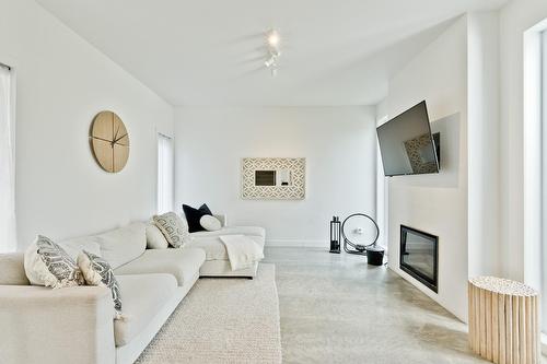 Living room - 145 Ch. Hivernon, Sutton, QC - Indoor Photo Showing Living Room With Fireplace