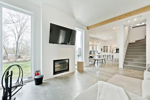 Overall view - 145 Ch. Hivernon, Sutton, QC - Indoor Photo Showing Living Room With Fireplace