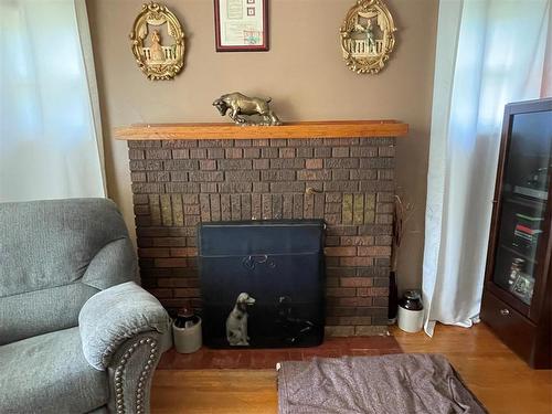 280 2Nd Avenue, Swan River, MB - Indoor Photo Showing Living Room With Fireplace