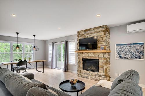 Living room - 416 Ch. De Montfort, Piedmont, QC - Indoor Photo Showing Living Room With Fireplace