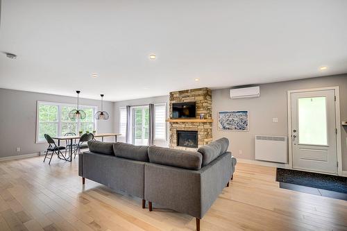 Living room - 416 Ch. De Montfort, Piedmont, QC - Indoor Photo Showing Living Room With Fireplace