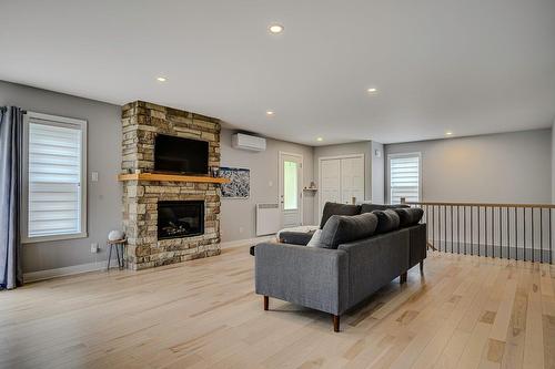 Living room - 416 Ch. De Montfort, Piedmont, QC - Indoor Photo Showing Living Room With Fireplace