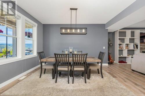 Loads of natural light surrounds the dining area - 313 Baldy Place, Vernon, BC - Indoor Photo Showing Dining Room