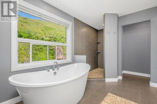 primary bath, very private, view of hillside - 313 Baldy Place, Vernon, BC - Indoor Photo Showing Bathroom