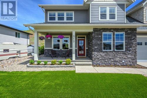 Front porch with quaint little potting beds. - 313 Baldy Place, Vernon, BC - Outdoor With Deck Patio Veranda With Facade