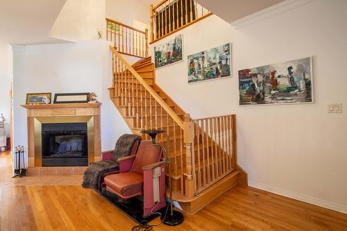 Living room - 49 Rue Des Arbres, Dollard-Des-Ormeaux, QC - Indoor Photo Showing Other Room With Fireplace