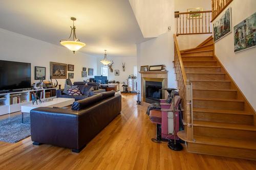 Living room - 49 Rue Des Arbres, Dollard-Des-Ormeaux, QC - Indoor Photo Showing Other Room With Fireplace