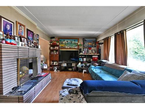 307, 311,315 Holly Ave, Nanaimo, BC - Indoor Photo Showing Living Room With Fireplace