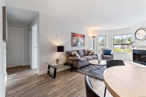 213-2815 Departure Bay Rd, Nanaimo, BC - Indoor Photo Showing Living Room With Fireplace