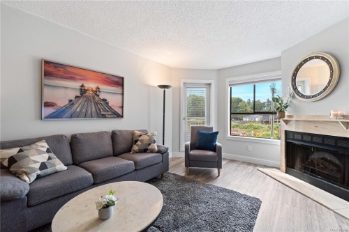 213-2815 Departure Bay Rd, Nanaimo, BC - Indoor Photo Showing Living Room With Fireplace