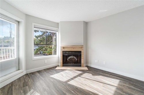 213-2815 Departure Bay Rd, Nanaimo, BC - Indoor Photo Showing Living Room With Fireplace