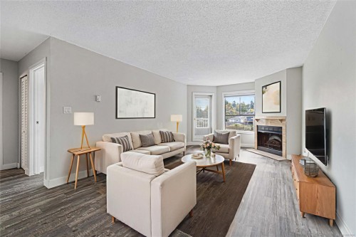 213-2815 Departure Bay Rd, Nanaimo, BC - Indoor Photo Showing Living Room With Fireplace