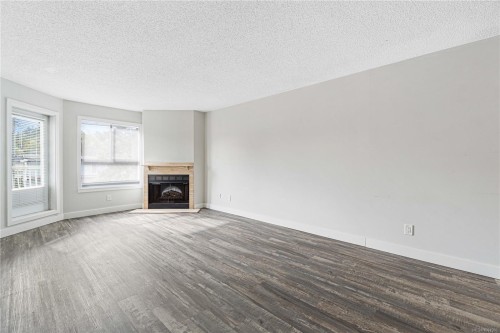213-2815 Departure Bay Rd, Nanaimo, BC - Indoor Photo Showing Living Room With Fireplace
