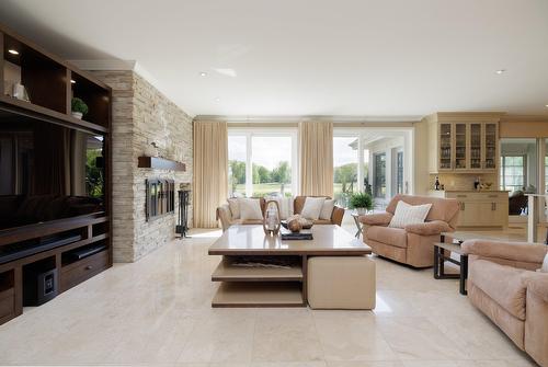 Living room - 22 Place Madison, Hudson, QC - Indoor Photo Showing Living Room With Fireplace