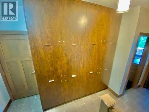 Storage lockers at bottom of stairs (photo of similar unit) - 101 Dormie Drive Unit# 4G, Vernon, BC - Indoor Photo Showing Other Room