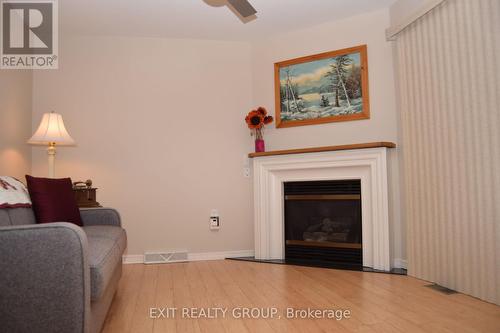 9 Empire Boulevard, Prince Edward County (Wellington Ward), ON - Indoor Photo Showing Living Room With Fireplace