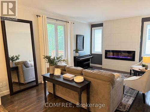62 Menard Street, Russell, ON - Indoor Photo Showing Living Room With Fireplace