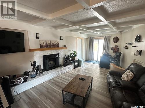 129 Birch Drive, Weyburn, SK - Indoor Photo Showing Living Room With Fireplace
