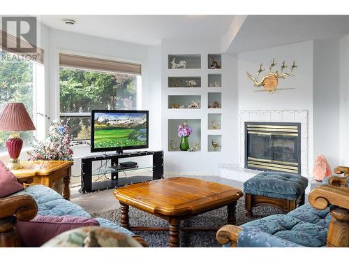 8827 Michael Drive, Coldstream, BC - Indoor Photo Showing Living Room With Fireplace