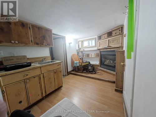 1169 Oxford Street E, London East (East G), ON - Indoor Photo Showing Kitchen With Fireplace