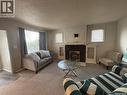 101 32Nd Street W, Saskatoon, SK  - Indoor Photo Showing Living Room With Fireplace 