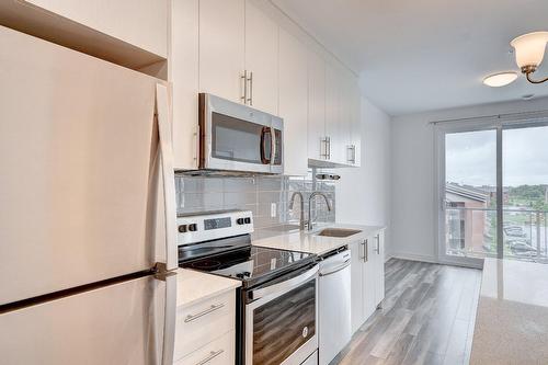 Cuisine - 410-7105 Rue De Lunan, Brossard, QC - Indoor Photo Showing Kitchen With Upgraded Kitchen