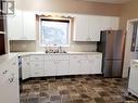 228 4Th Street E, Ponteix, SK  - Indoor Photo Showing Kitchen With Double Sink 