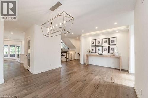 Dining room with wood-type flooring, recessed lighting, stairs, and baseboards - 346 Lexington Road, Waterloo, ON - Indoor