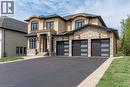 View of front of house featuring stucco siding, stone siding, and asphalt driveway - 346 Lexington Road, Waterloo, ON  - Outdoor With Facade 