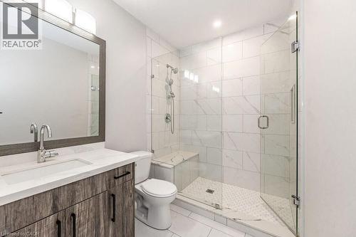 Bathroom featuring a stall shower, toilet, vanity, and tile patterned floors - 346 Lexington Road, Waterloo, ON - Indoor Photo Showing Bathroom