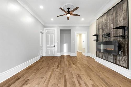 Living room - 200-1572 Av. Summerhill, Montréal (Ville-Marie), QC - Indoor Photo Showing Other Room With Fireplace