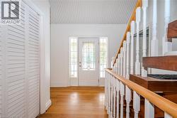 Entryway with light wood-style flooring and baseboards - 