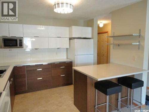 #104 2160 Cornwall Street, Regina, SK - Indoor Photo Showing Kitchen With Double Sink