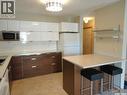 #104 2160 Cornwall Street, Regina, SK  - Indoor Photo Showing Kitchen With Double Sink 