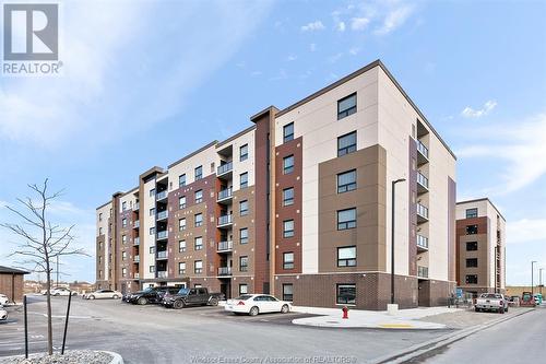 716 Brownstone Unit# 404, Tecumseh, ON - Outdoor With Balcony With Facade